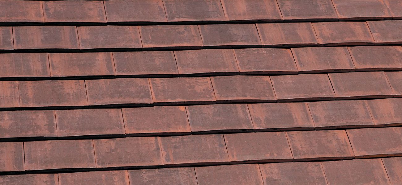 A close up of Marley clay plain roof tiles 