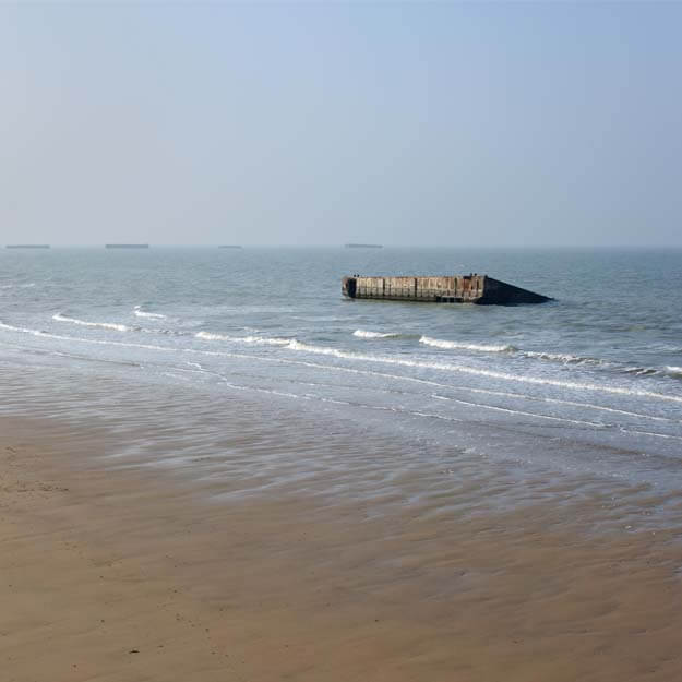 Sea of Arromanches where sections of the mulberry harbour survive to this day