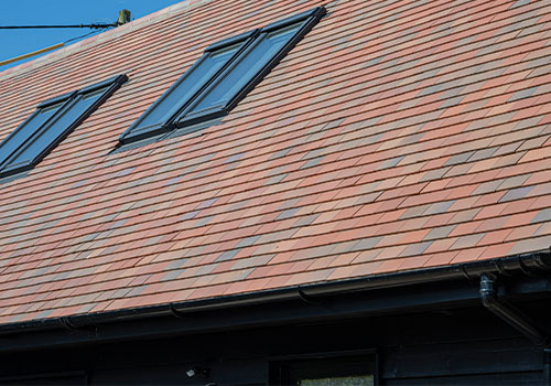 Marley clay plain tiles installed on a residential roof.