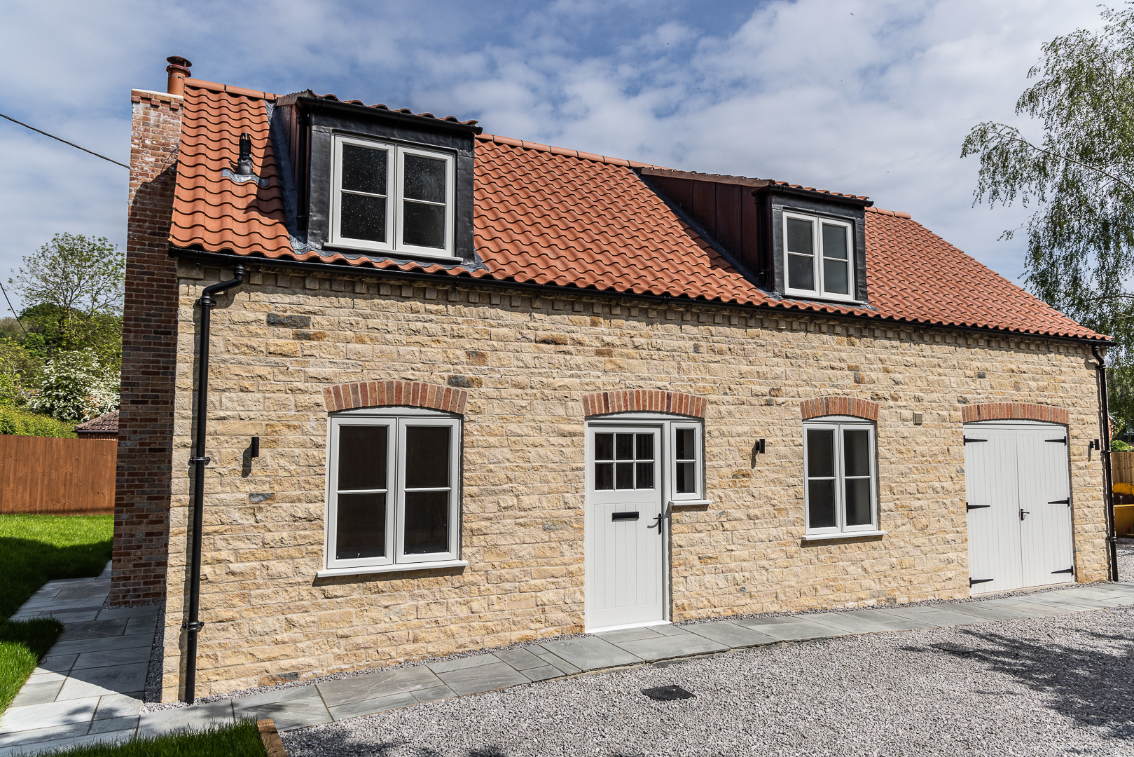 A front elevation view of a house with Lincoln clay roof tiles installed